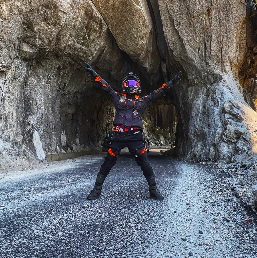 Karan Gill on his motorcycle in a remote mountain range