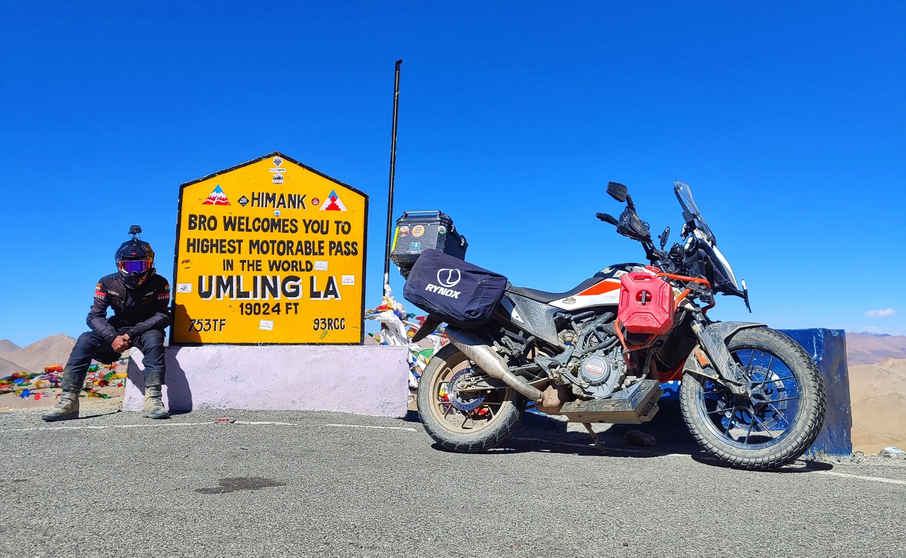 Karan Gill on his KTM 390 Adventure motorcycle in a remote mountain range